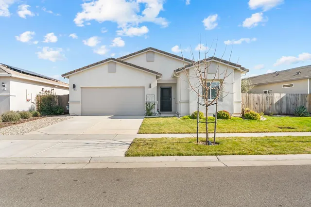 a view of backyard of house with wooden floor and outdoor seating