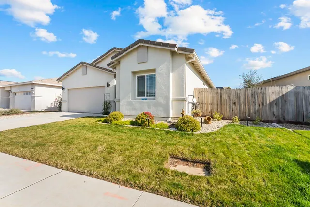 a bathroom with a sink toilet and shower curtain