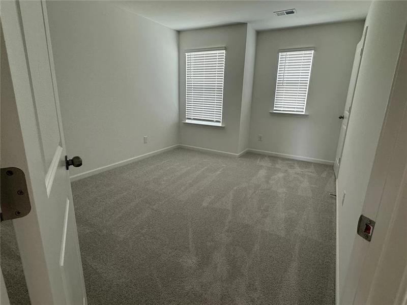100 Mission Boulevard Pendergrass, GA 30567 - Photo 8 of 17 a view of an empty room with windows
