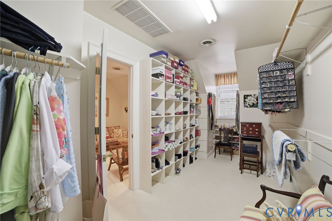 3950 Reeds Landing Circle Midlothian, VA 23113 - Photo 20 of 50 a view of walk in closet with clothes and shoes
