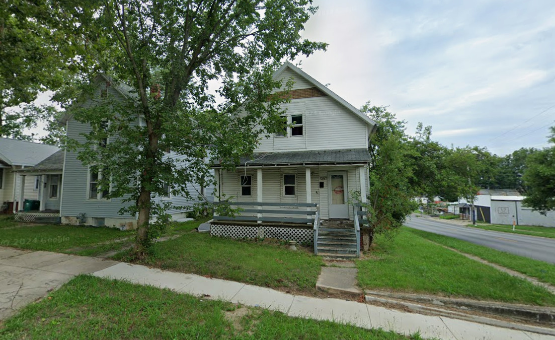 1097 West Green Street Decatur, IL 62522 - Photo 2 of 7 a front view of house with a garden