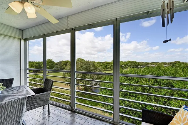 a view of a chairs and tables in the balcony