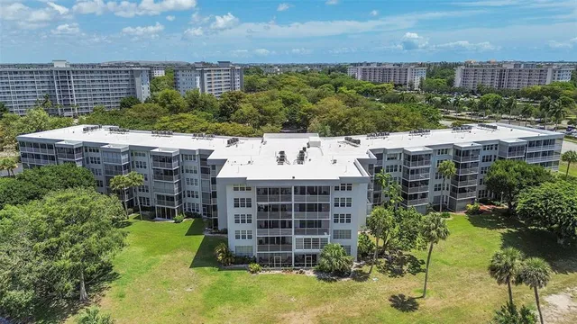 an aerial view of a city with lake view