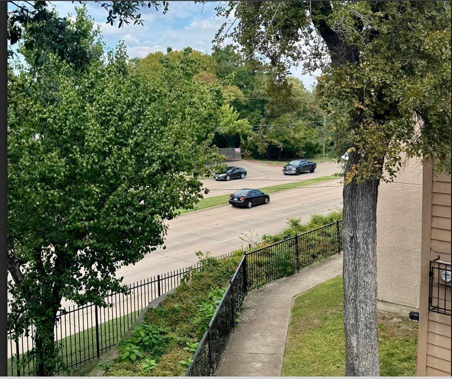 8110 Skillman Street, Unit 2057 Dallas, TX 75231 - Photo 16 of 16 a view of a yard with plants