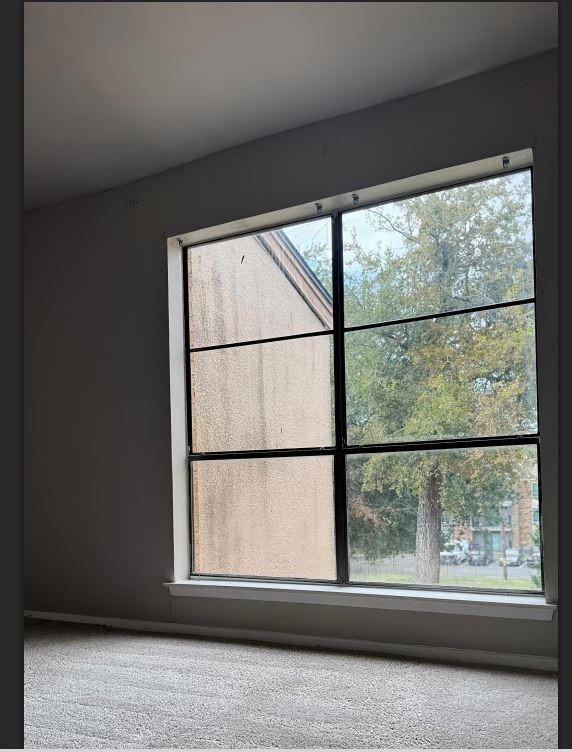8110 Skillman Street, Unit 2057 Dallas, TX 75231 - Photo 5 of 16 a view of a large window with a small yard