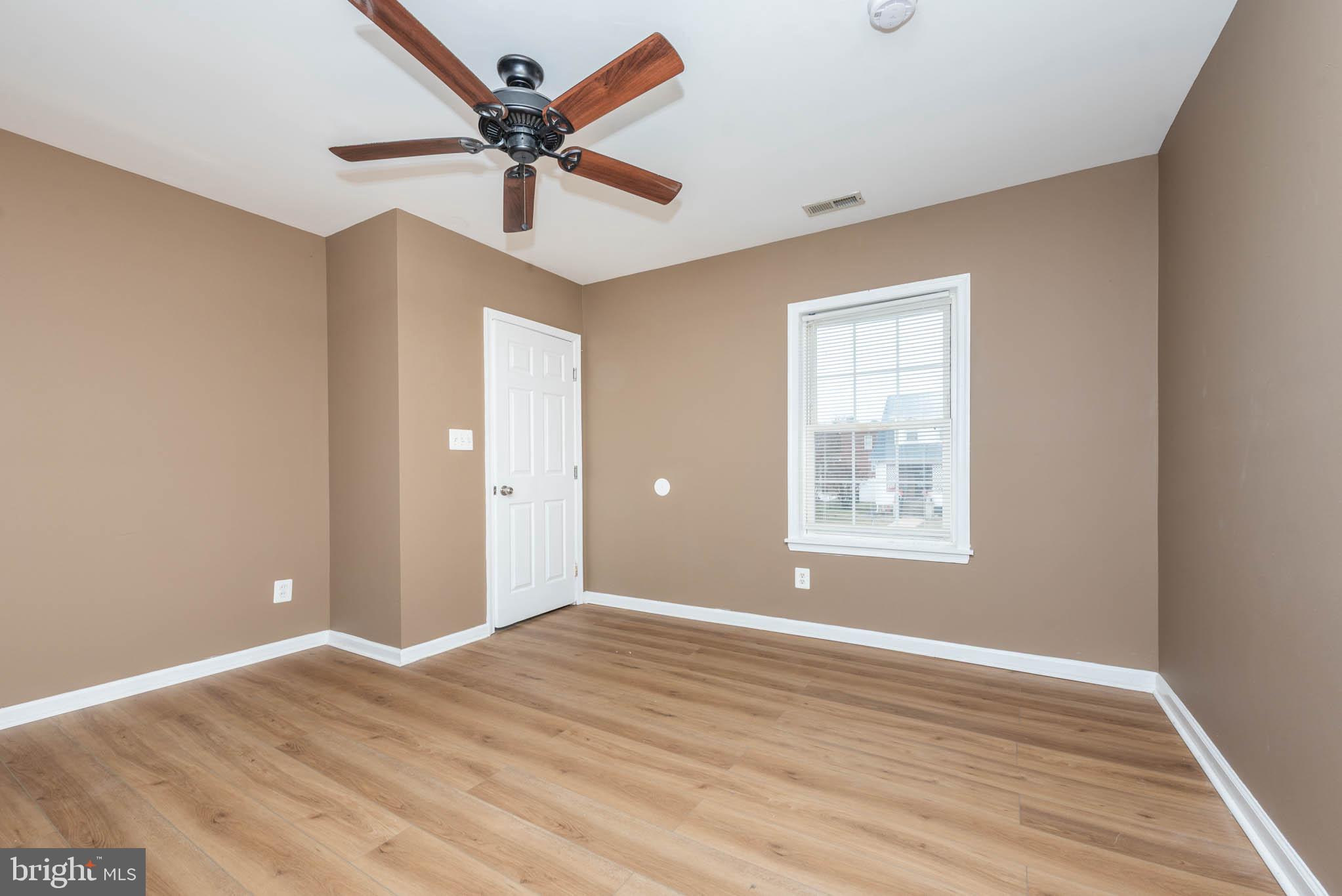 4021 Barrington Road Baltimore, MD 21207 - Photo 16 of 50 a view of an empty room with a window