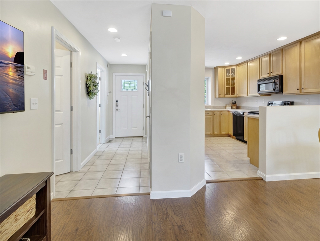 13 Shawmut Avenue, Unit 13 Mansfield, MA 02048 - Photo 8 of 34 a view of a kitchen cabinets and wooden floor