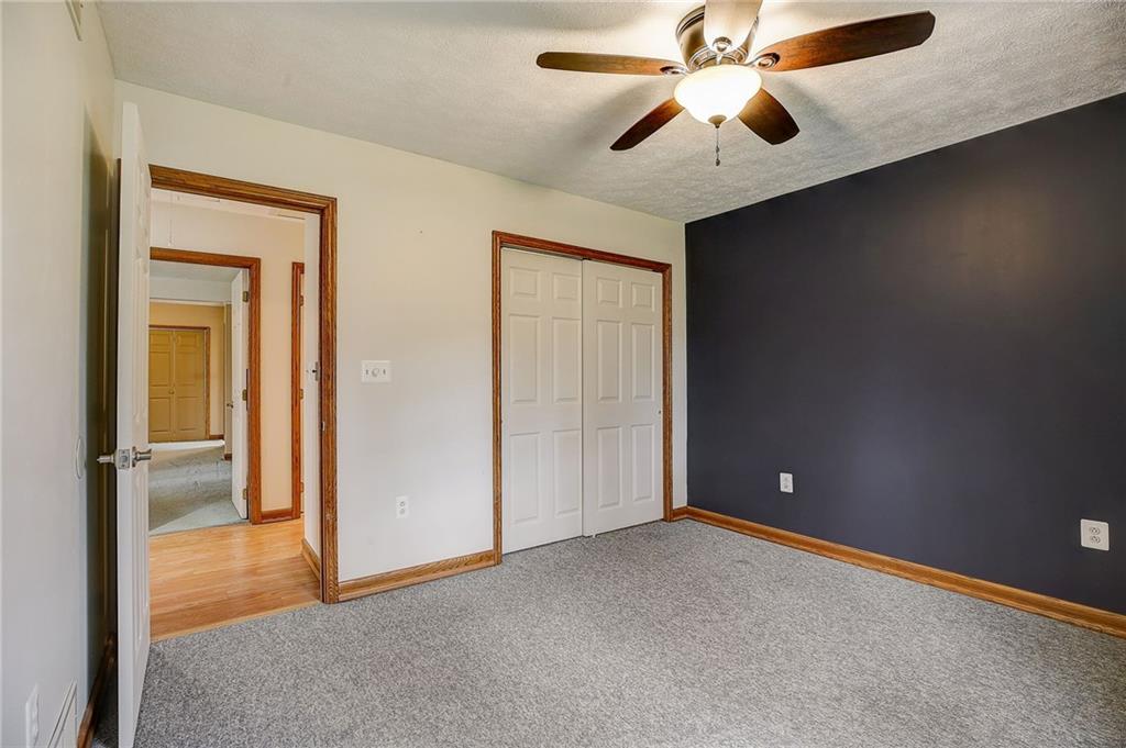1199 Lower Mateer Road Vandergrift, PA 15690 - Photo 32 of 45 an empty room with closet and a chandelier fan