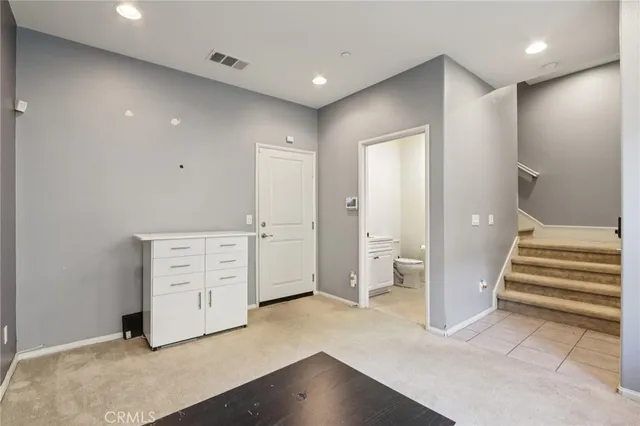 a bathroom with a sink vanity and a mirror