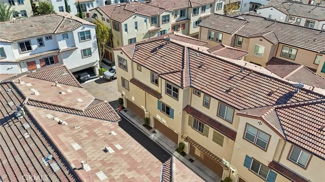 an aerial view of a city with lots of residential buildings