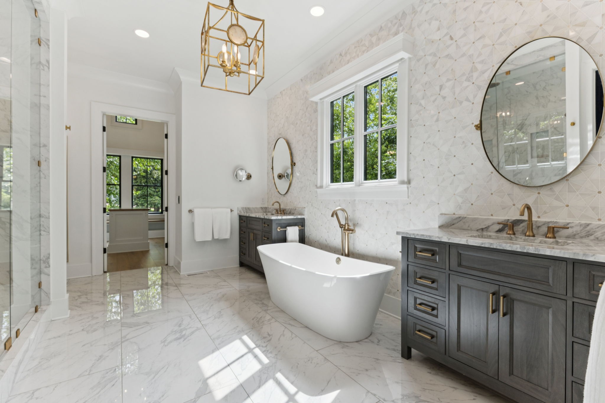910 Robertson Academy Road Nashville, TN 37220 - Photo 17 of 57 a spacious bathroom with a bathtub and a mirror