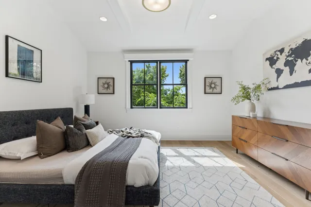 a bedroom with a bed and window