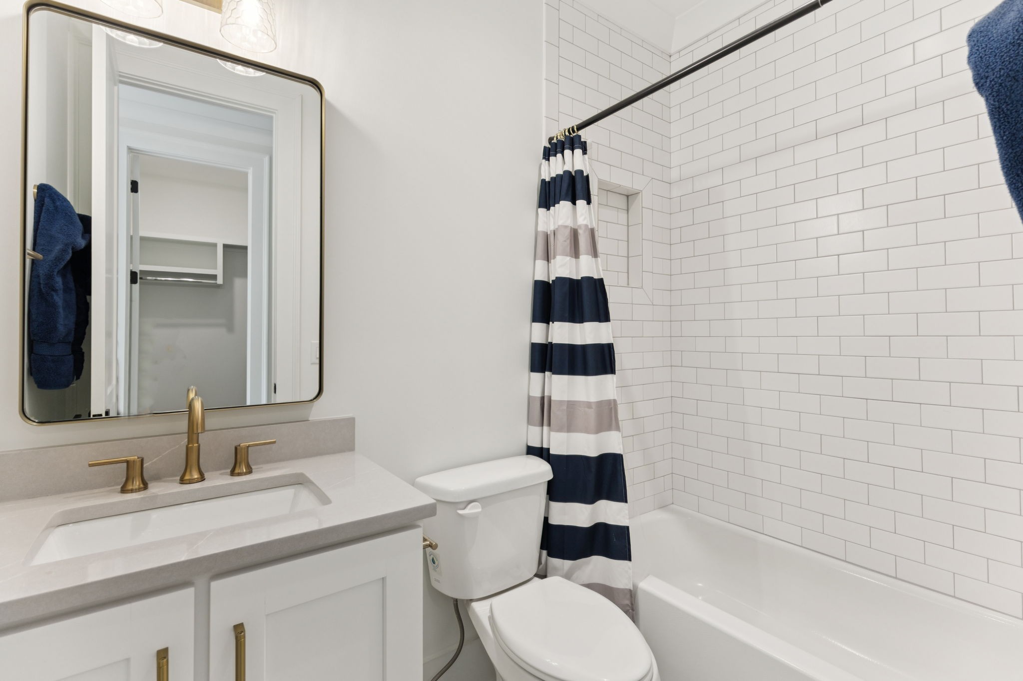 910 Robertson Academy Road Nashville, TN 37220 - Photo 30 of 57 a bathroom with a sink toilet vanity and shower