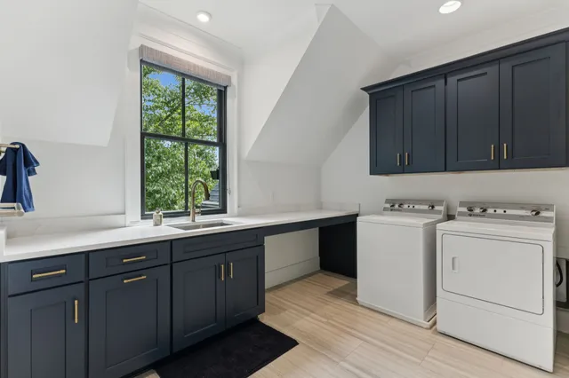 a bathroom with a sink mirror and vanity