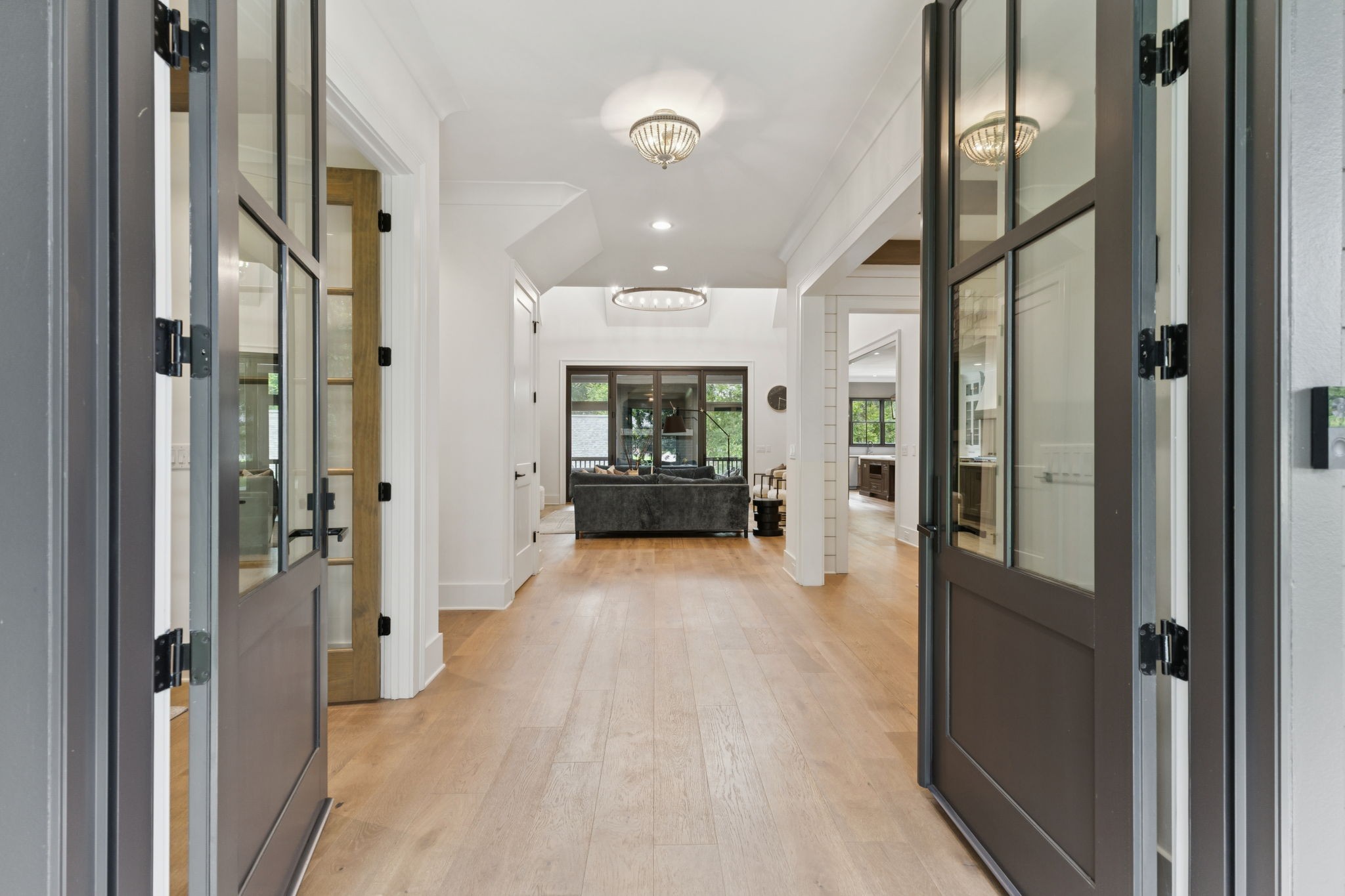 910 Robertson Academy Road Nashville, TN 37220 - Photo 6 of 57 a view of a hallway with wooden floor and a living room