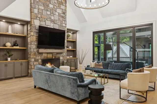a living room with fireplace furniture and a flat screen tv