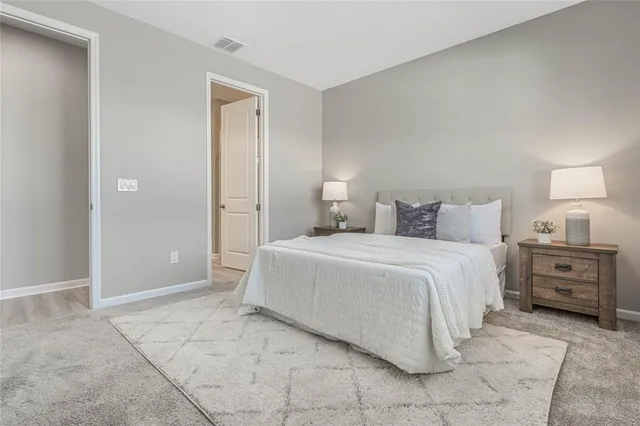 a bedroom with a bed and a cabinets