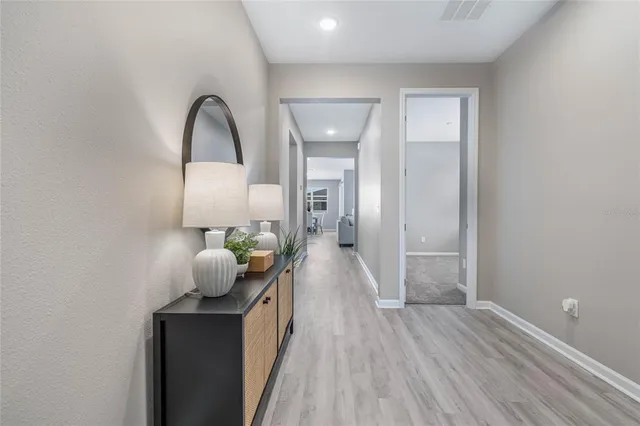 a hallway with wooden floor