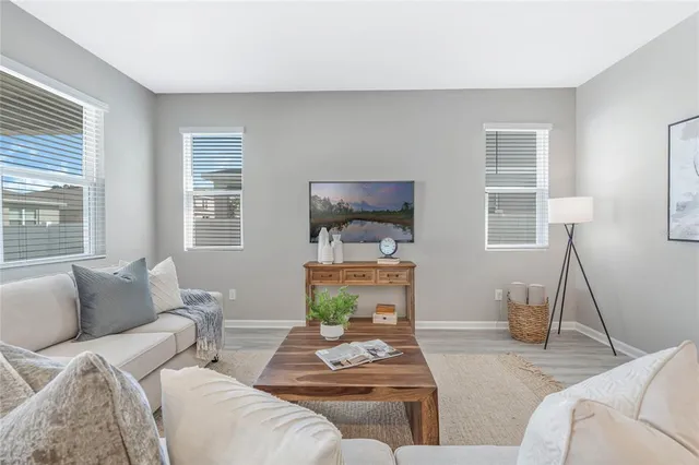 a living room with furniture and a window
