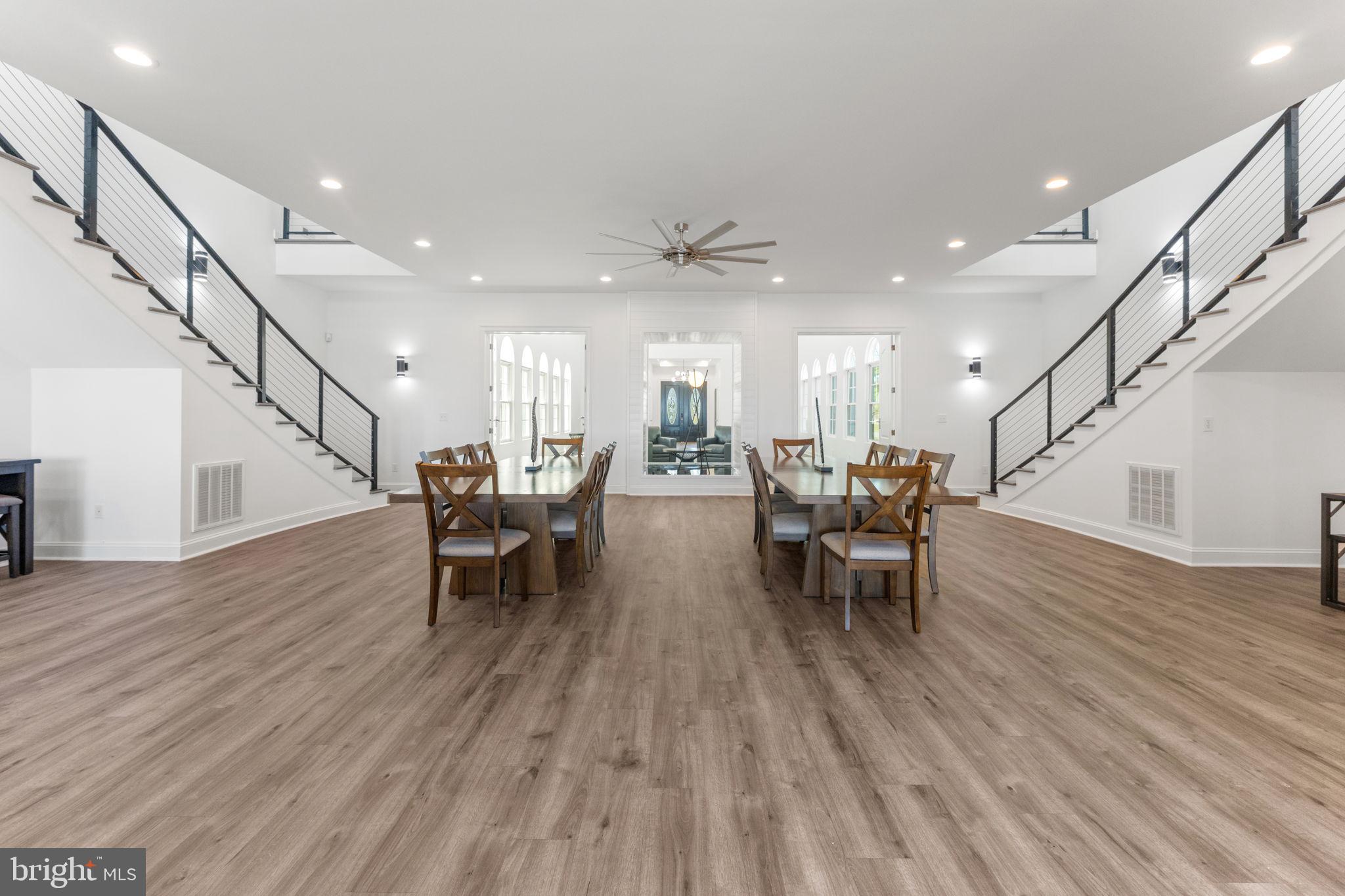 3315 Windmill Point Road White Stone, VA 22578 - Photo 19 of 45 a view of a dining room with furniture and wooden floor