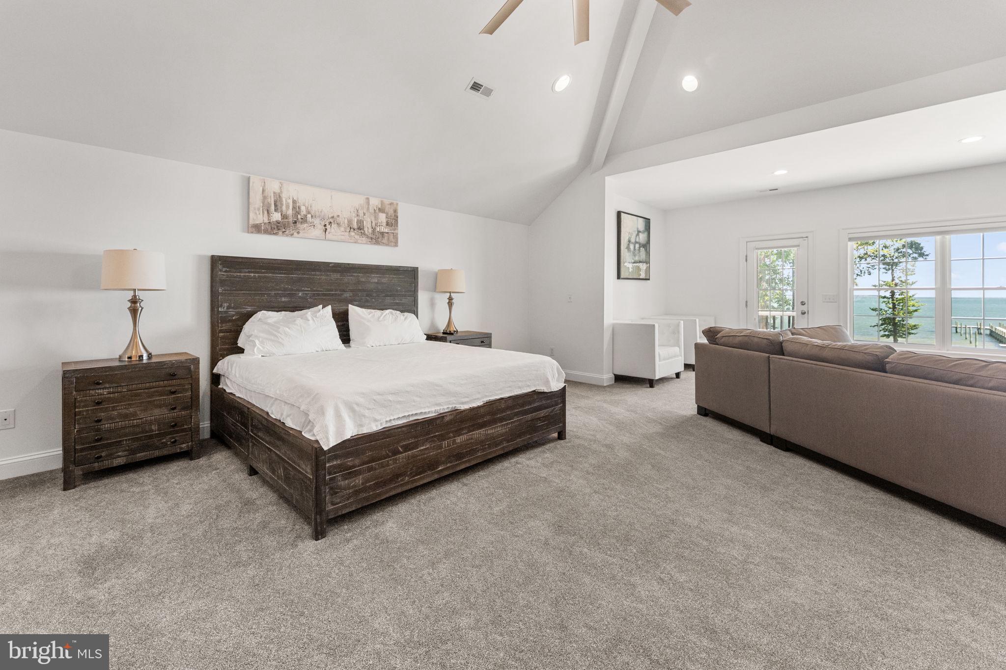 3315 Windmill Point Road White Stone, VA 22578 - Photo 21 of 45 a bedroom with a bed and a night stand