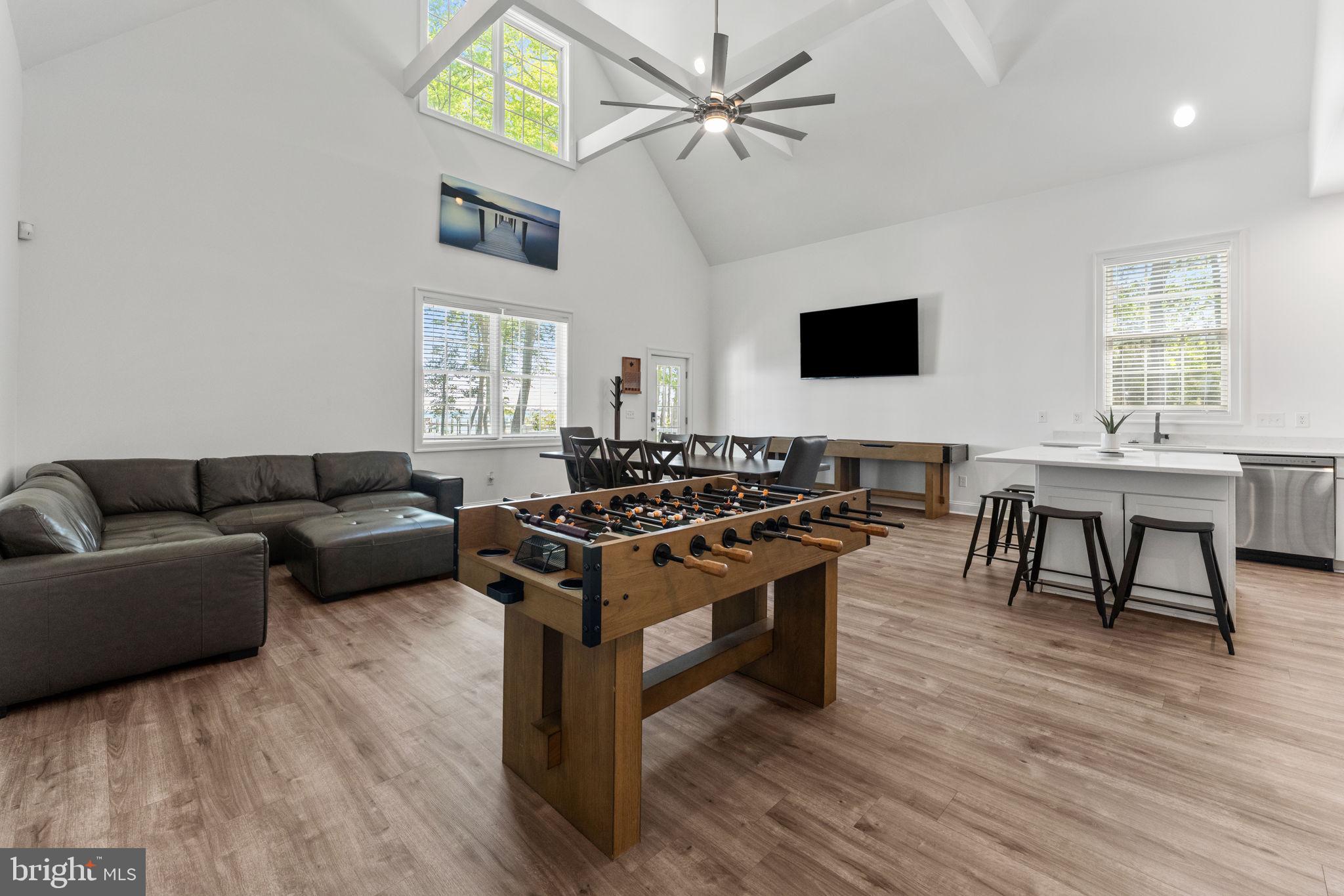 3315 Windmill Point Road White Stone, VA 22578 - Photo 27 of 45 a living room with furniture a wooden floor and a window