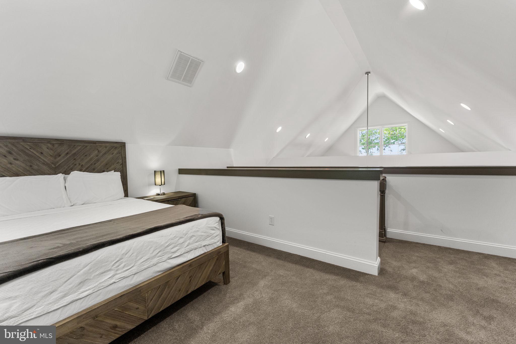 3315 Windmill Point Road White Stone, VA 22578 - Photo 33 of 45 a bedroom with a bed and a painting