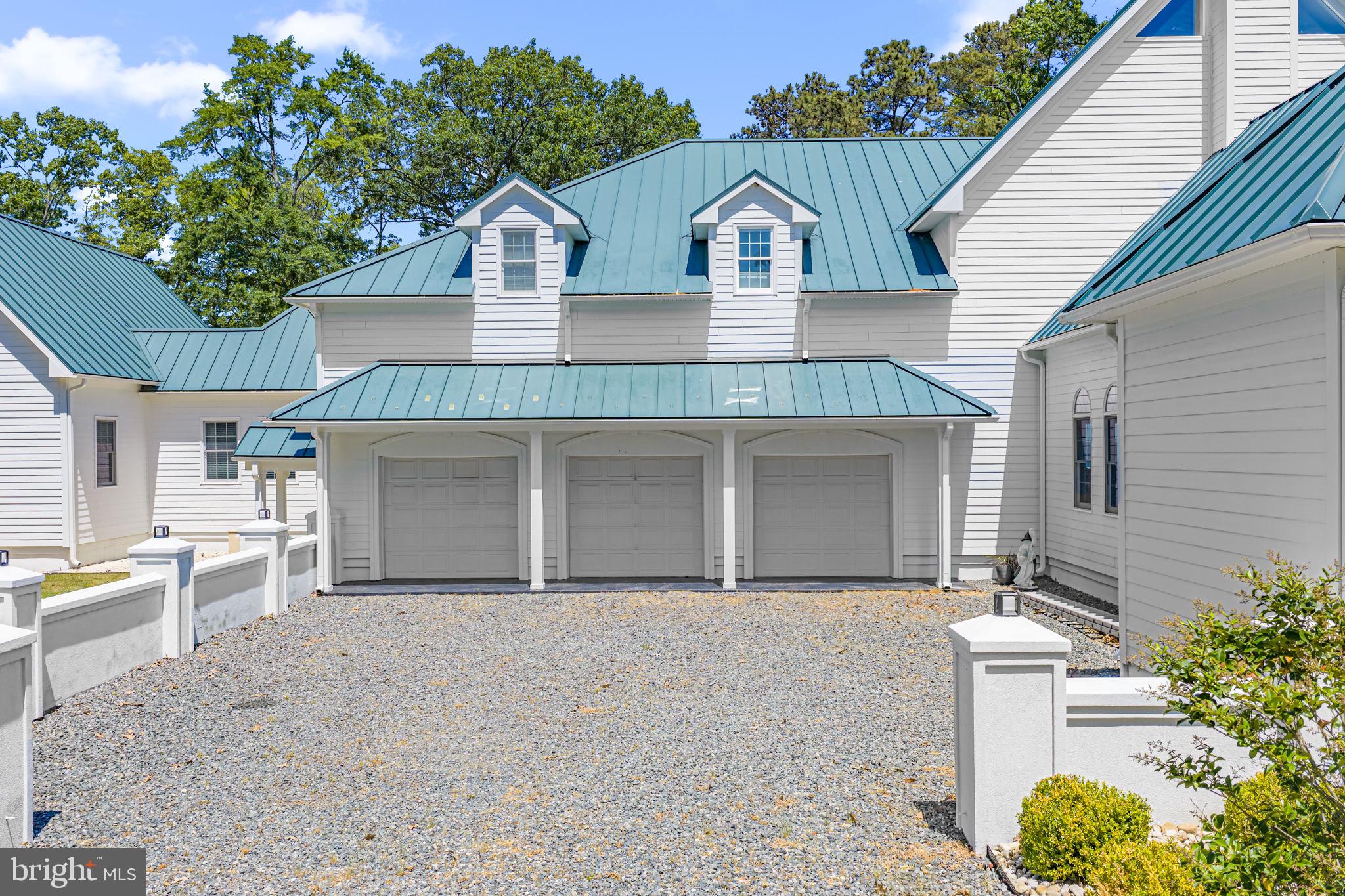 3315 Windmill Point Road White Stone, VA 22578 - Photo 45 of 45 a front view of a house with a garden and patio