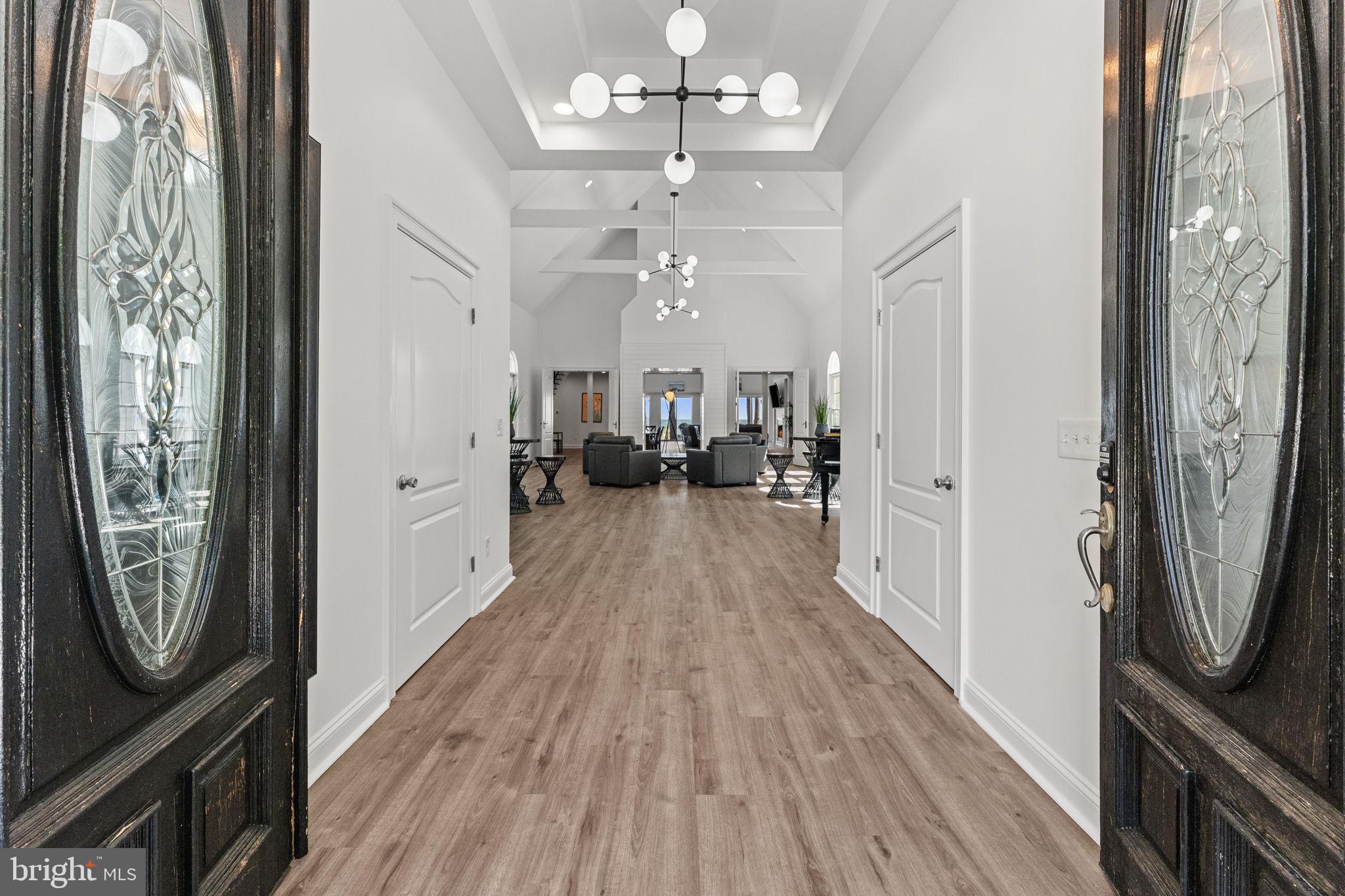 3315 Windmill Point Road White Stone, VA 22578 - Photo 6 of 45 a view of a hallway with wooden floor and staircase