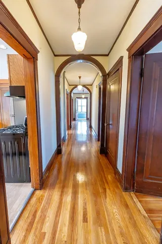 a view of gallery with wooden floor