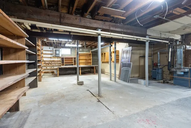 a view of empty room with wooden ceiling