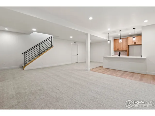 a kitchen with a sink and a refrigerator