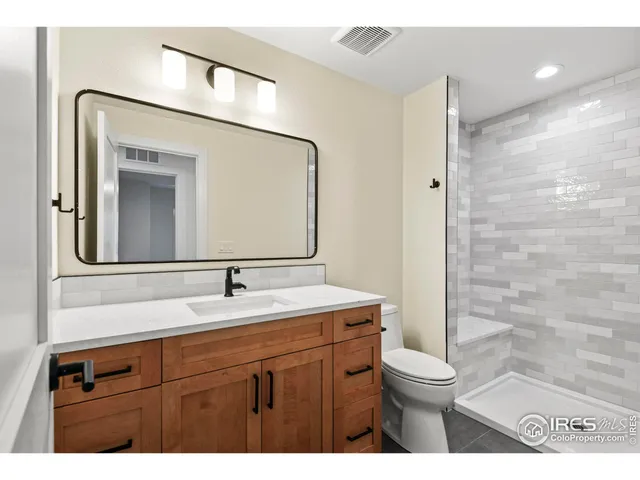 a view of an empty room with windows