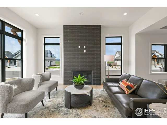 a living room with furniture or window and a potted plant