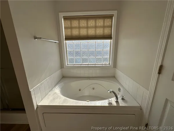 a bathroom with a glass shower door