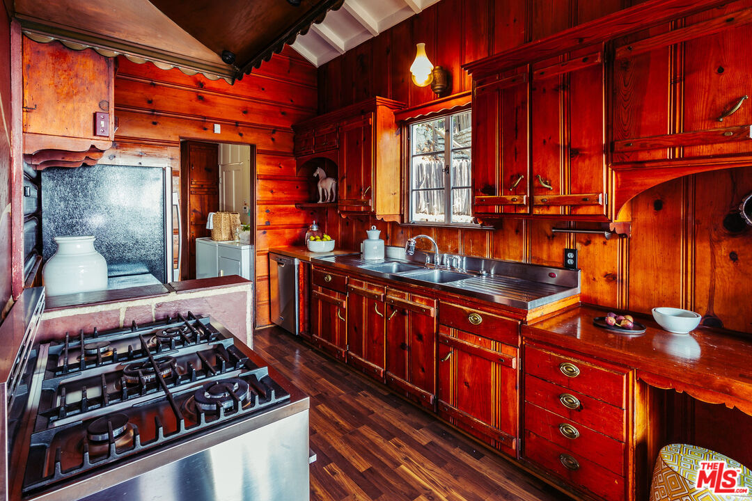 2780 Outpost Drive Los Angeles, CA 90068 - Photo 13 of 20 a kitchen with stainless steel appliances granite countertop a stove a sink and dishwasher