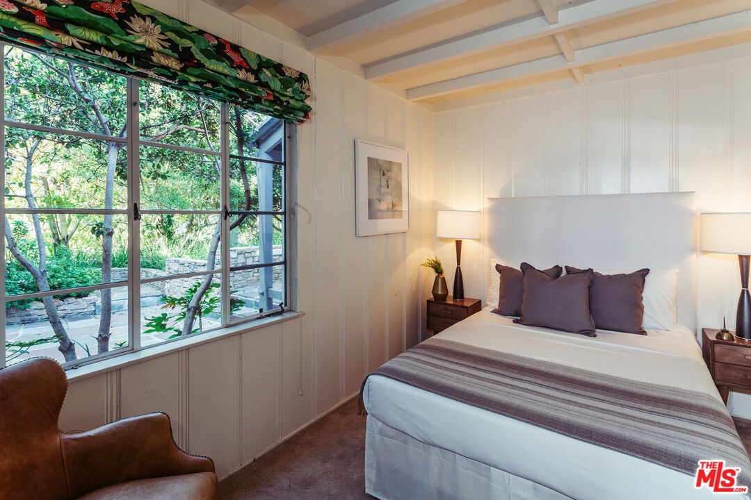 2780 Outpost Drive Los Angeles, CA 90068 - Photo 15 of 20 a bedroom with a large bed and a window