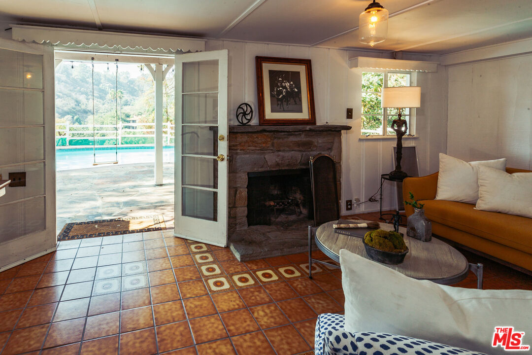 2780 Outpost Drive Los Angeles, CA 90068 - Photo 16 of 20 a living room with furniture and a fireplace