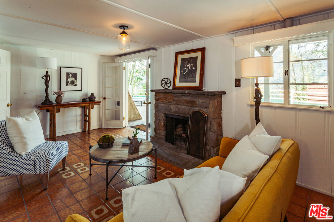 2780 Outpost Drive Los Angeles, CA 90068 - Photo 17 of 20 a living room with furniture and a fireplace