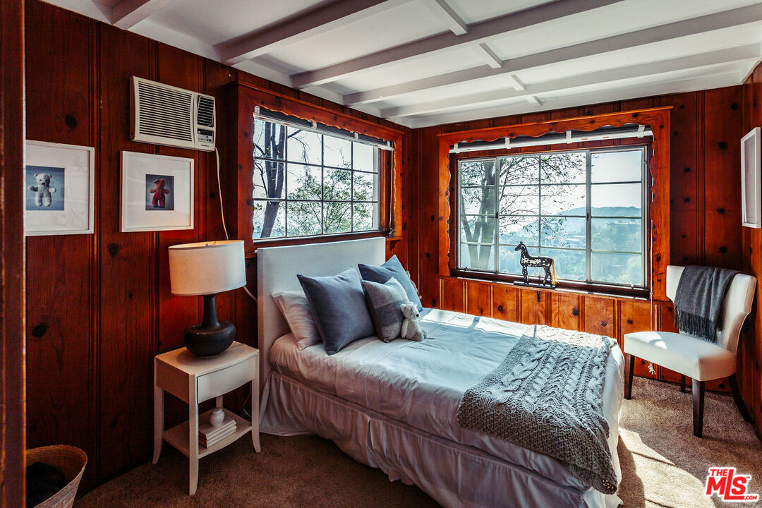 2780 Outpost Drive Los Angeles, CA 90068 - Photo 9 of 20 a bedroom with furniture and large windows