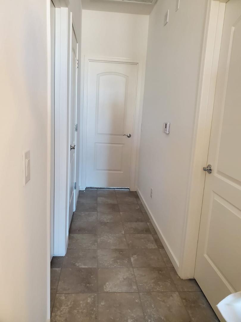 3900 East Baseline Road, Unit 118 Phoenix, AZ 85042 - Photo 26 of 32 a view of a hallway with a wooden cabinets