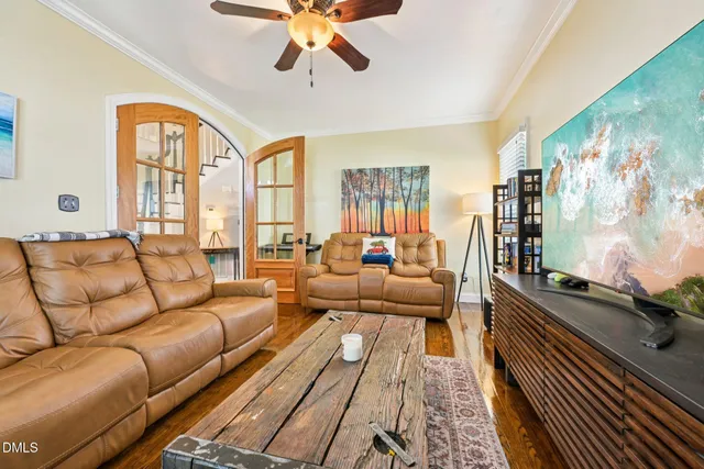 a living room with furniture fireplace and flat screen tv