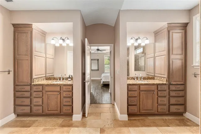 a bedroom with a bed a couch and a window