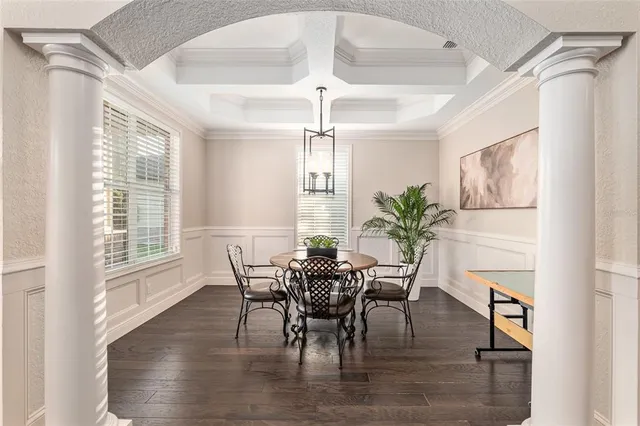 a view of a dining room with furniture window and wooden floor