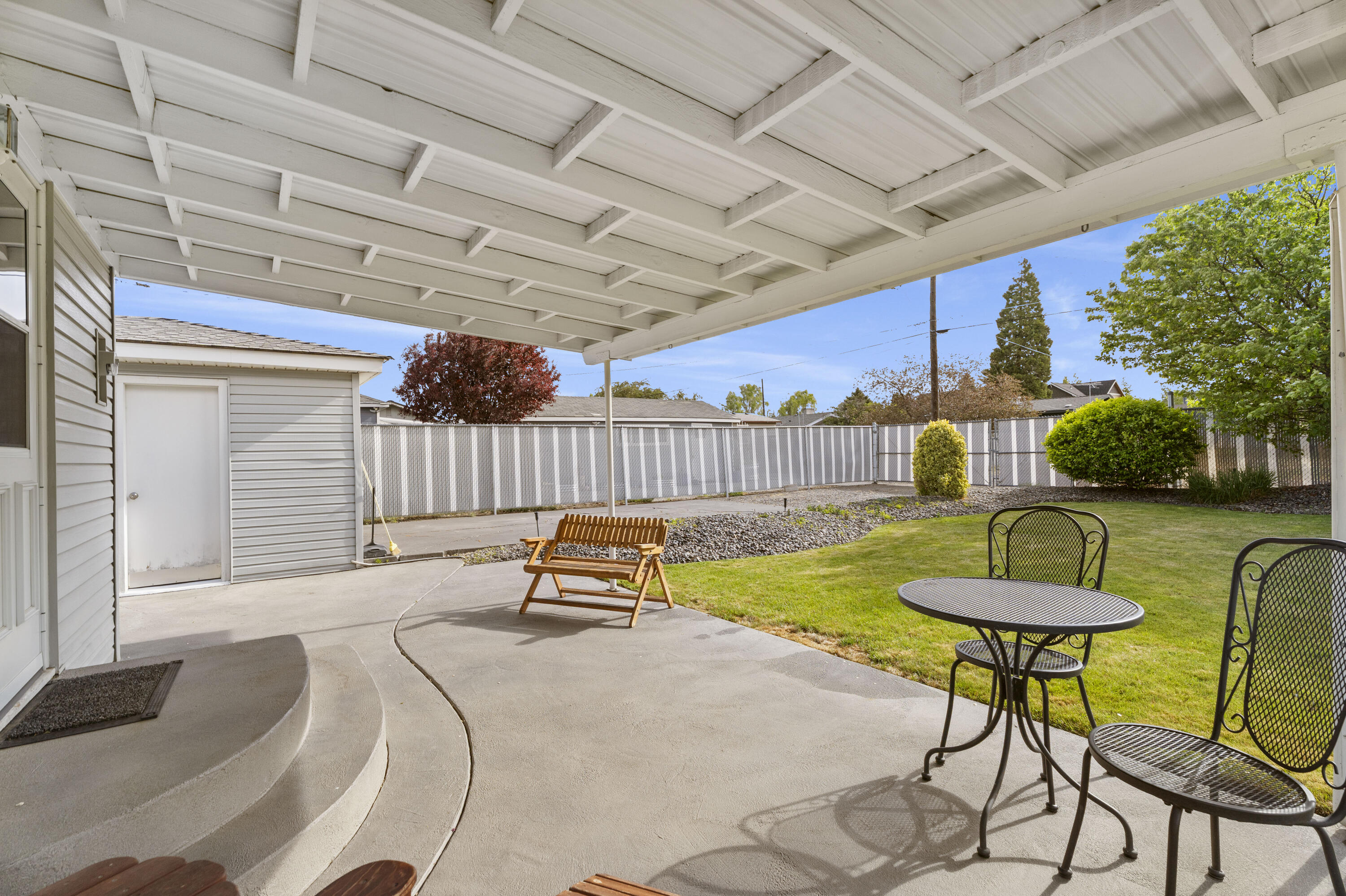 946 Southwest 13th Street Redmond, OR 97756 - Photo 45 of 49 a view of a patio with a table and chairs