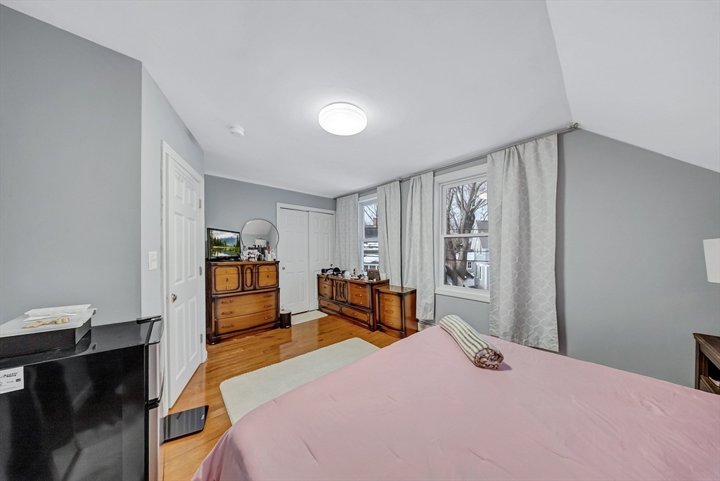 30 Fuller Street Seekonk, MA 02771 - Photo 17 of 42 a bedroom with a bed and wooden floor