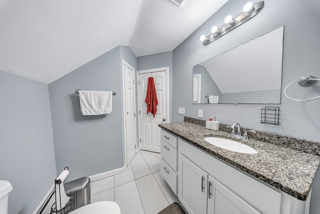 30 Fuller Street Seekonk, MA 02771 - Photo 22 of 42 a bathroom with a granite countertop double vanity sink and a mirror