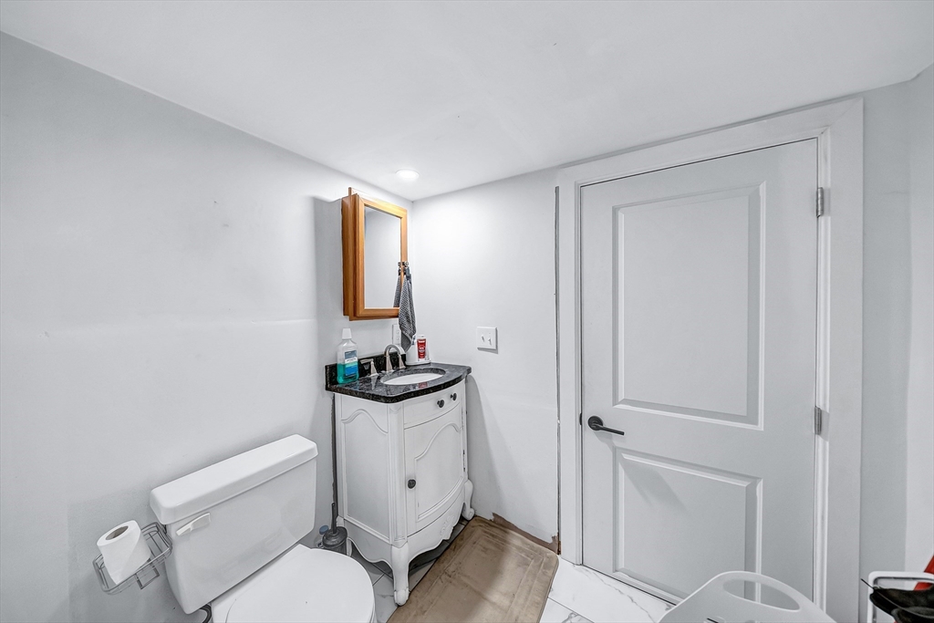 30 Fuller Street Seekonk, MA 02771 - Photo 31 of 42 a bathroom with a toilet a sink and mirror