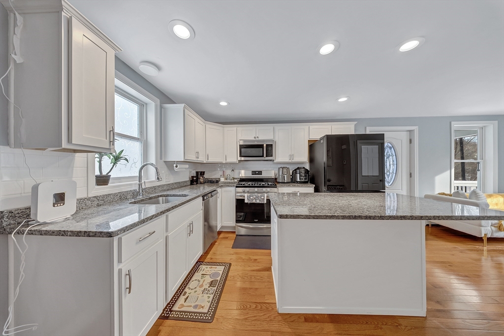 30 Fuller Street Seekonk, MA 02771 - Photo 7 of 42 a large kitchen with granite countertop a large counter top stainless steel appliances and cabinets
