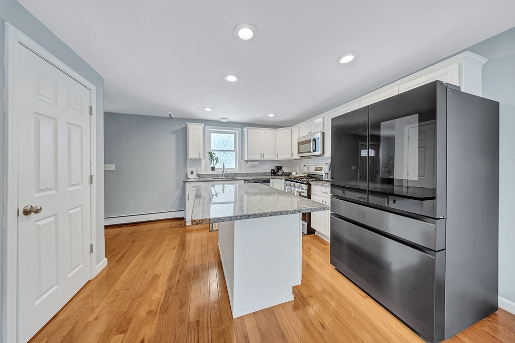 30 Fuller Street Seekonk, MA 02771 - Photo 8 of 42 a kitchen with stainless steel appliances granite countertop a refrigerator and a stove top oven